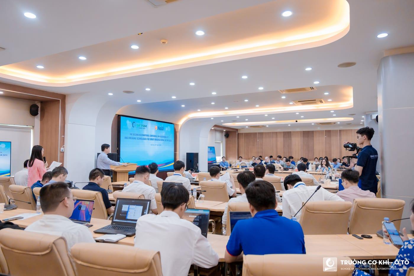 Delegates seated at the conference tables during a technical session