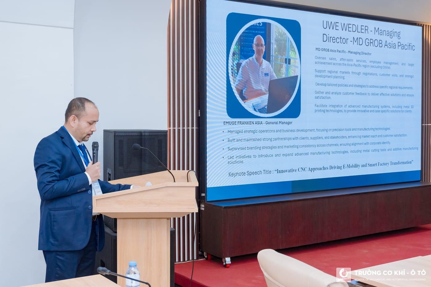 A keynote speaker presenting from the podium