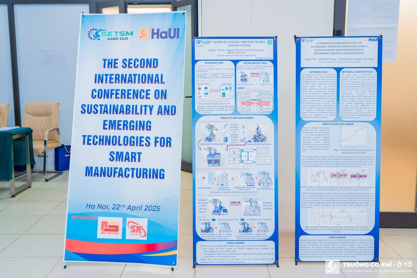 Research posters and the conference banner displayed in the foyer