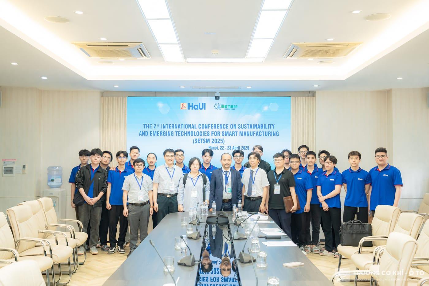 Delegates gathered for a group photograph in the conference room